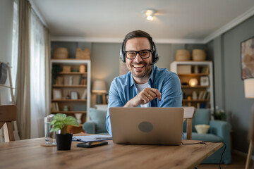 Wall Mural - One man caucasian male freelancer work from home on laptop computer