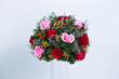 Beautiful bouquet arranged in a vase, on a white background