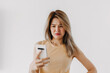 © Suthida - Boring and disappointed asian women wear yellow top looking at mobile
