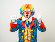 Mr Clown. Portrait Of Funny Face Clown Man In Colorful Uniform Standing Variety Action. Happy Expression Male Bozo In Various Pose On Isolated Background.
