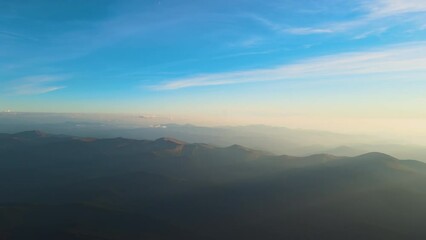 Sticker - Beautiful mountain panoramic landscape with hazy peaks and foggy valley at sunset