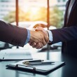 © RM Graphics - business people shaking hands