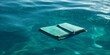 Libro flotando en el agua con un bolígrafo, mockup libro flotando en el mar aislado