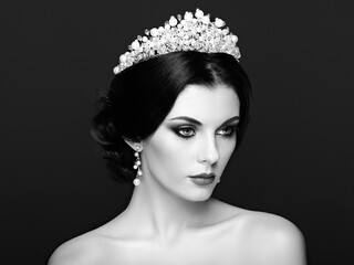 Poster - Fashion Portrait of Beautiful Woman with Tiara on head. Elegant Hairstyle. Perfect Make-Up and Jewelry. Red Lips. Black and White photo