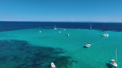 Wall Mural - Drone view of a sailing yacht. Luxury transportation. Vacationing people. Vacation and holidays. Summer time for sea travel. The sea bay. Footage for background and wallpaper. Mediterranean Sea.