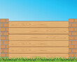 Beautiful decorative fence from boards and brick