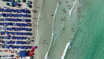 Poster - Aerial view on beach, people and umbrellas. Vacation and adventure. Europe, Mediterranean Sea. Top view from drone at beach and azure sea. View on the coast from drone. 