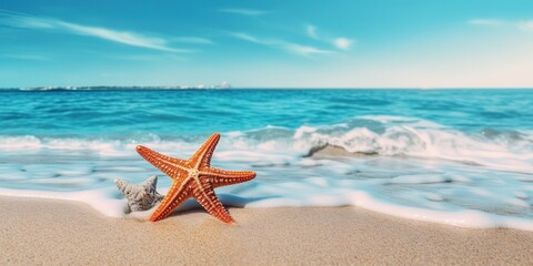 Poster - Starfish on the beach at the edge of the blue water on a sunny day, American flag.