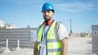 © Krakenimages.com - African american man builder standing with relaxed expression at street