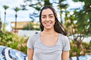 Canvas Print - Young beautiful hispanic woman smiling confident standing at park