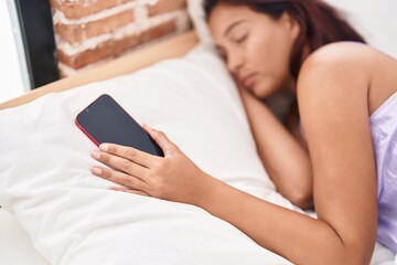 Wall Mural - Young beautiful hispanic woman lying on bed sleeping at bedroom