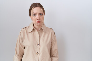 Sticker - Young caucasian woman wearing casual shirt depressed and worry for distress, crying angry and afraid. sad expression.