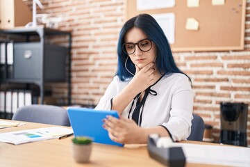 Sticker - Young caucasian woman business worker using touchpad working at office