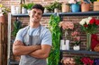 © Krakenimages.com - Young hispanic man florist smiling confident standing with arms crossed gesture at flower shop