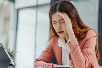 Wall Mural - Businesswoman and stress, How can they fight it? Pain, including back pain, Acne and other skin problems, like rashes, hives. Headaches. Upset stomach. Feeling like you have no control. Lack of focus