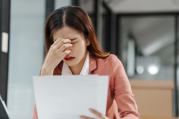 Wall Mural - Businesswoman and stress, How can they fight it? Pain, including back pain, Acne and other skin problems, like rashes, hives. Headaches. Upset stomach. Feeling like you have no control. Lack of focus