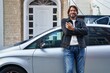 © Krakenimages.com - Middle age man smiling confident holding key of new car at street