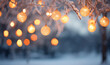 canvas print picture - leuchtende Lichterkette mit winterlichen Bokeh als Hintergrund