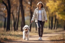 Old Sportive Woman Walking Her Dog In The Park In Autumn Day, AI Generated