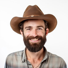 Close-up Of Smiling Man With Beard In A Cowboy Hat