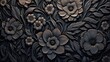 Black background tone with embossed floral pattern on metal surface.