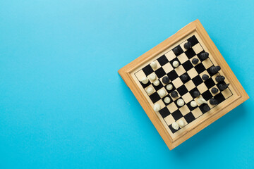 Wall Mural - Wooden chess on color background, top view