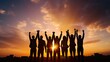 © HN Works - Group of business team members raising hands in the sunset sky background to depict teamwork