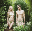 © Vorkrath - adam looking at eve hiding in garden of eden wearing natural underwear - Generative AI