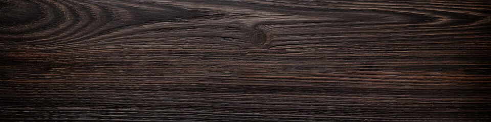 Wall Mural - Wide banner with dark wenge wood texture as a background.