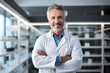 © Oksana_Latysheva - Smiling doctor with crossed arms photo portrait