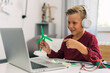 © cherryandbees - A young pupil is explaining how the windmill work on a model n an online class.