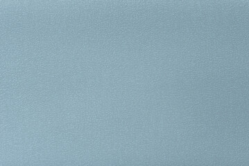 Leather texture of light blue artificial surface, background.