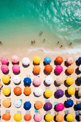 Wall Mural - Aerial view of tropical beach with colorful umbrellas