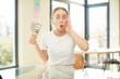 © kues1 - young pretty caucasian woman feeling extremely shocked and surprised. dollar banknotes concept
