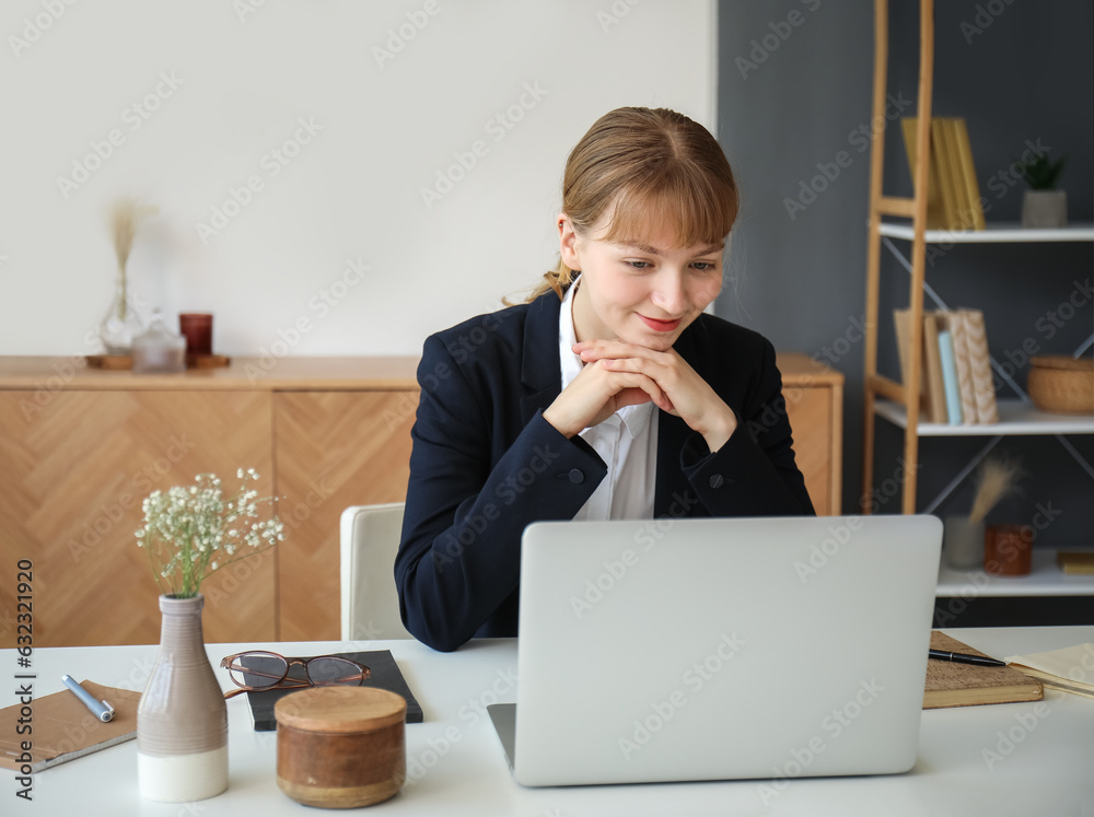 Young woman having job interview online at home