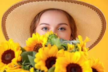 Wall Mural - Young woman with beautiful sunflowers on yellow background, closeup