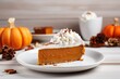 Piece of pumpkin pie with whipped cream on plate on wooden table