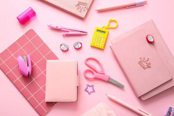 Wall Mural - Different school stationery and notebooks on pink background