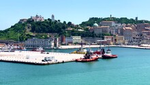 The Coast Of Ancona With Ships Moored At The Shore. With A Beautiful City In The Background