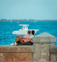 Wall Mural - couple relaxing on the beach malecón miami cubans 