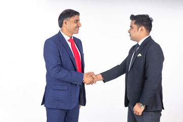 Two indian businessman shake hand on white background.