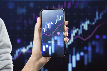 Poster - Close up of female hand holding tablet with glowing growing forex chart on blurry background. Trade, finance and stock market concept.