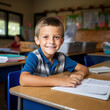 © mindstorm - caucasian boy sitting at school desk in classroom