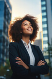 Fototapeta Zachód słońca - Successful happy business woman standing on financial district of a city,. Concept of diversity, resilience and empowerment