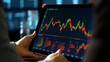 Hands holding a tablet showing stock market graphs and data, finance and investment, banner, business