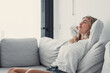 © Daniel - Young calm woman chilling relaxing leaning on comfortable sofa napping on couch in living room resting having healthy quiet nap, breathing fresh air, no stress free weekend at home, peace of mind.