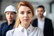 © altitudevisual - closeup shot of a female architect with her colleagues in the background