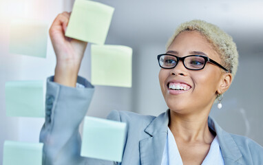 Writing, planning and happy business woman in office with sticky note goal, idea or strategy. Schedule, smile and happy female manager brainstorming calendar, mission or agenda, management or growth