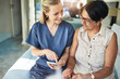 © aLListar/peopleimages.com - Happy woman, nurse and phone in elderly care for support, consultation or healthcare diagnosis at home. Female person, caregiver or medical professional on mobile smartphone to help senior patient