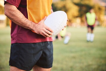 Sticker - Rugby, man and hands with ball for sports games, competition and contest on field. Closeup of athlete, team player and training at stadium for fitness, exercise and performance of challenge outdoor